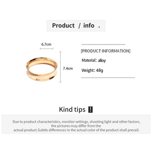 Detailed view of wide gold alloy cuff bracelet with concave polished metallic surface