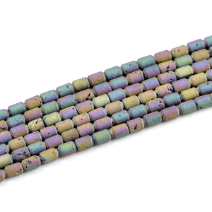 Macro shot of colorful cylindrical geode agate beads with sparkling crystal druzy texture