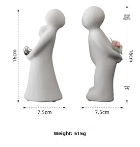Detailed dimensions of abstract couple figurines with silver heart and pink rose accents