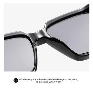 Detail of square black sunglasses showing smooth integrated nose pads for comfort