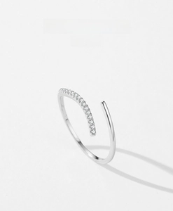 Macro detail of s925 silver open ring showing pavé-set zircons and polished minimalist lines