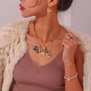 Chic multi-layer 18K gold plated jewelry set with butterfly pendants and pearl details