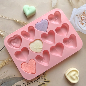 Pink silicone heart mold with 12 cavities for chocolate and colorful finished candies