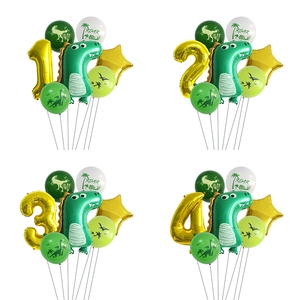 Detail view of dinosaur birthday balloon sets with green foil dinosaurs and gold numbers