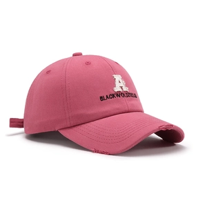 Pink cotton baseball cap with embroidered letter A and distressed brim detail