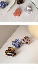 Detail showing various acetate hair claws with marble and tortoiseshell patterns