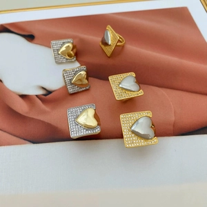 Mixed gold and silver heart-shaped open rings with cubic zirconia pavé square base set