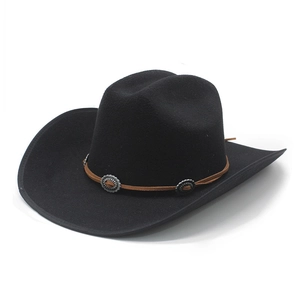 Detail of black felt cowboy hat featuring brown leather band with silver conchos