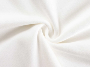 Close-up of white knit cotton fabric texture showing soft weave and thickness
