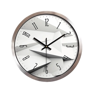 Modern silent wall clock with brushed silver metal frame and 3D geometric dial texture