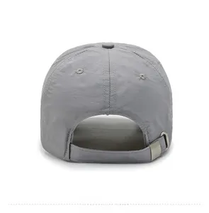 Detail of adjustable metal buckle and neat stitching on dark gray sport baseball cap
