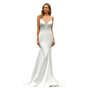 Elegant white satin mermaid bridal gown with deep V-neck and delicate spaghetti straps