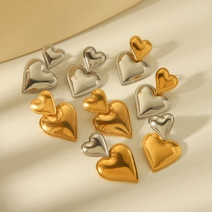 Elegant 18K gold and silver stainless steel heart earrings with textured finish