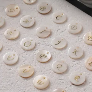 Natural freshwater shell round alphabet charms with golden A-Z letters for jewelry making