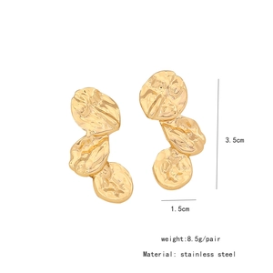 Detail view of irregular lava texture gold earrings with 3.5cm length dimensions