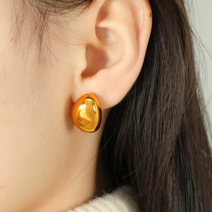 Polished gold irregular teardrop hoop earrings in punk style for a minimalist look