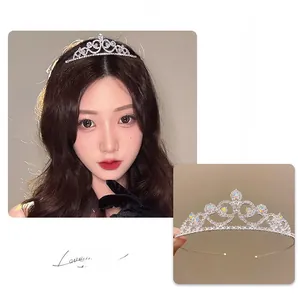 Detailed macro view of an elegant silver rhinestone crown showing intricate alloy craftsmanship