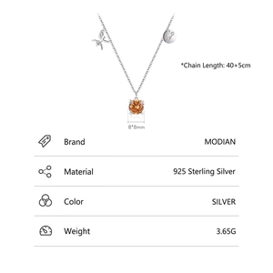 925 sterling silver Pisces necklace with orange zircon and celestial charms on white background
