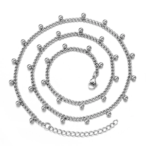 Minimalist silver stainless steel necklace with small beads and extension chain on white