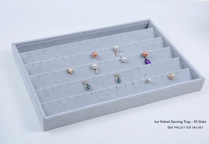 Close-up of light grey ice velvet jewelry tray holding 45 pairs of stud earrings