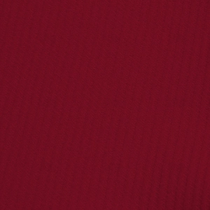 Detailed macro view of dark red waffle knit fabric texture on men's long sleeve polo shirt