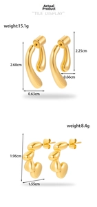 Macro view of gold irregular liquid metal earrings with mirror finish and asymmetric design
