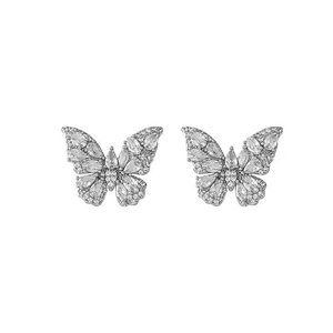 Elegant zircon butterfly ear clips in a minimalist metal design with sparkling crystals