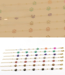 Detail of colorful crystal flower charm bracelet with adjustable gold lobster clasp