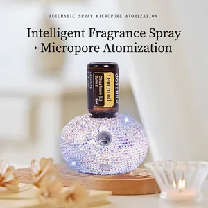 Macro shot of micro-porous atomizer base with rhinestones and essential oil bottle