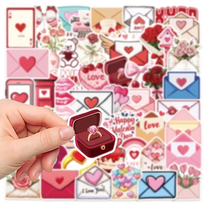 Macro shot of a hand holding a heart ring box sticker from a Valentine's Day sticker set