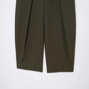 Women's dark olive high-waist pleated balloon pants with wide hem and woven texture