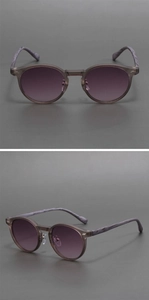Detail view of round vintage matte sunglasses with purple gradient lenses and marble temples