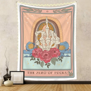 Detail of tarot style tapestry featuring a skeleton hand and decorative wall lighting