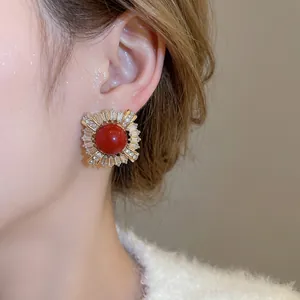 French retro gold stud earrings with a red gemstone and radiating zircon crystals