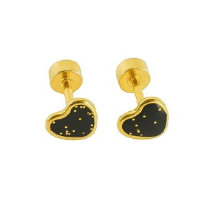 Detailed macro view of heart-shaped gold titanium steel studs with black enamel polka dots