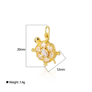 Detailed size view of gold turtle pendant with cubic zirconia, 20mm by 12mm, 1.4g