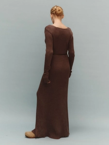 Detail of the back view of a dark brown ribbed knit maxi dress with a square neckline