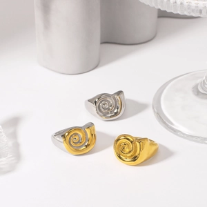 Modern sculptural stainless steel rings with spiral texture in gold and silver finishes