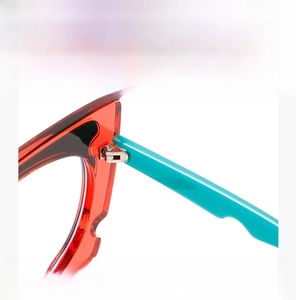 Detailed macro view of smooth metal hinges on colorful anti-blue light glasses