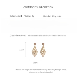 Detailed view of opal leaf tassel earrings with size measurements of 2.5cm and 6.8cm