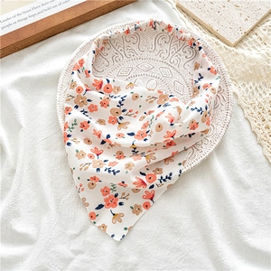Detailed view of floral elastic headband on an elegant ceramic plate background