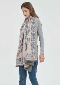 Detail view of pink and blue paisley scarf with soft texture and elegant fringe edges
