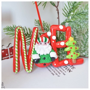 Close-up of red NOEL hanging ornament with 3D Santa and mini tree for Christmas decor