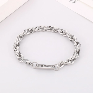 Close-up of silver titanium steel square plate pendant and textured twist chain link
