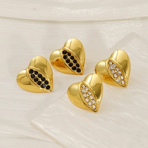 Polished heart earrings in gold finish with black and white crystal inlay set on silk