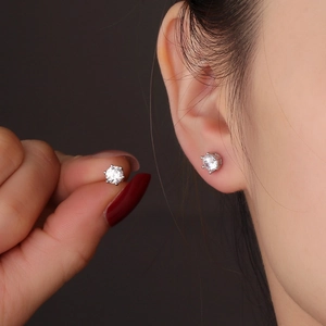 Classic S925 silver hexagram stud earrings with sparkling cubic zirconia on model