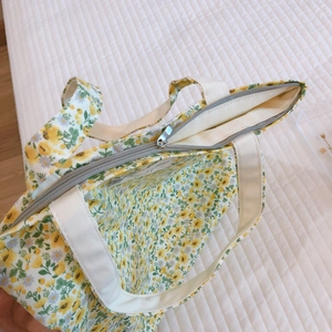 Floral cotton mini tote bag with yellow print and zipper closure for casual use