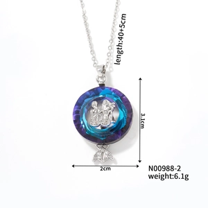 Detail view of Gemini coin pendant with blue crystal and technical size measurements
