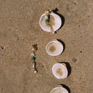 Golden ocean theme drop earrings with pearls and fish charms on beach shells