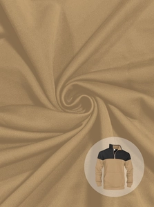 Macro detail of khaki knit fabric texture on a long sleeve half-zip polo sweatshirt